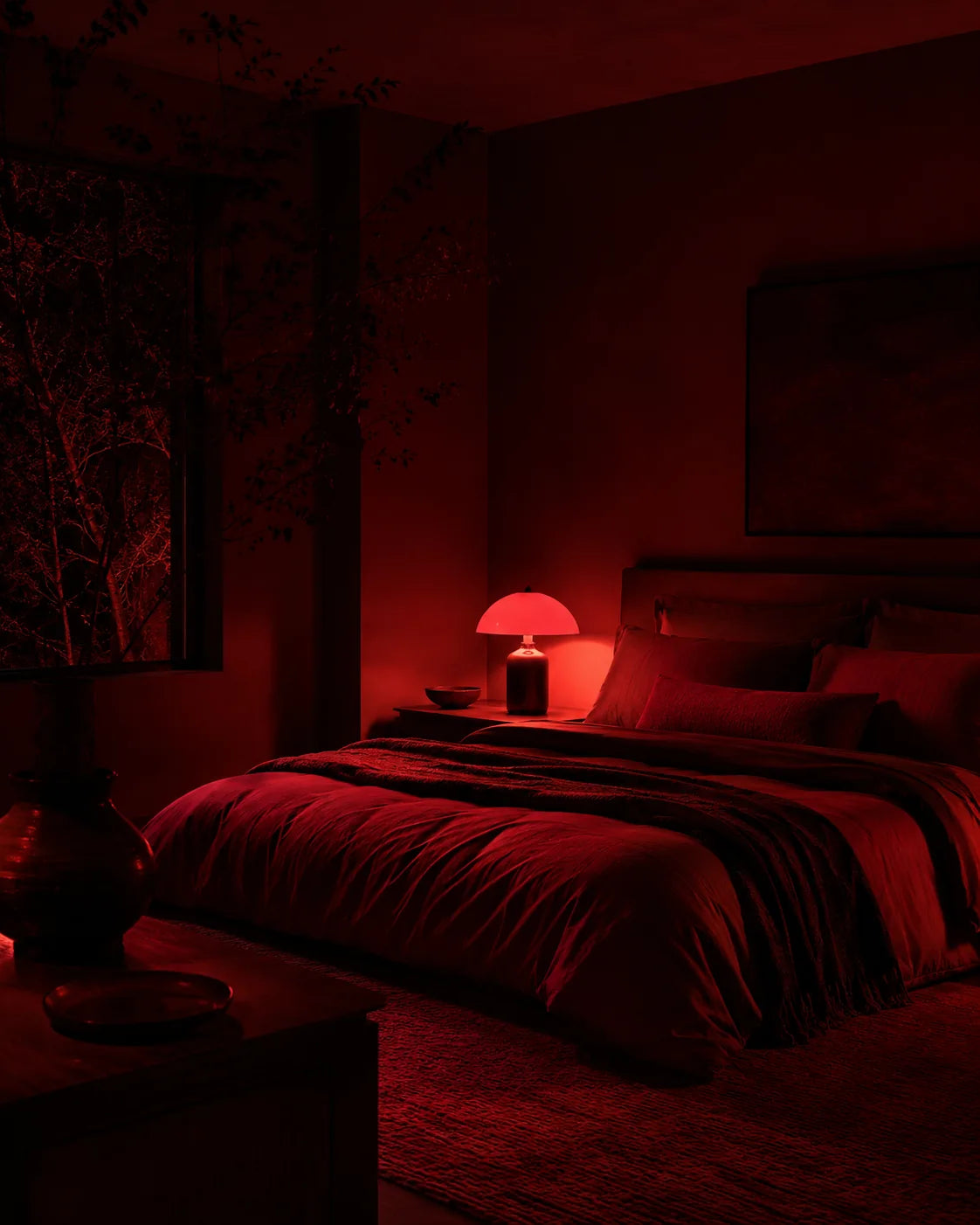 Bedroom illuminated by deep red ambient light at night